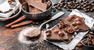 Chocolat and spices on black table