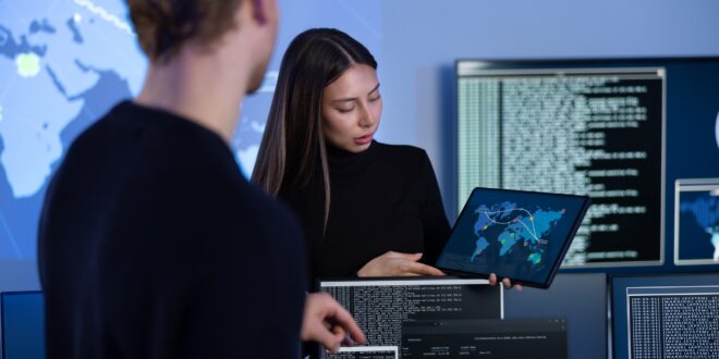 Cyber security team working in a Cyber Security Operations Center SOC to protect systems and