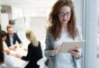 Elegant smart businesswoman in company office