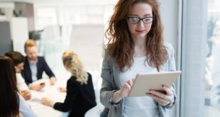 Elegant smart businesswoman in company office