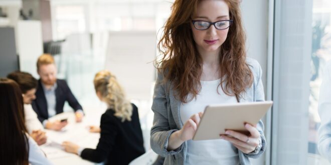 Elegant smart businesswoman in company office