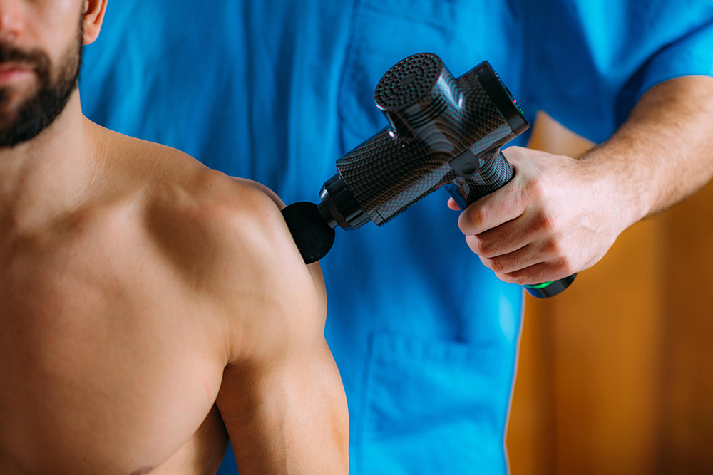 pistolet de massage epaule