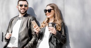 Stylish couple on the grey background