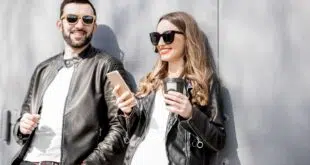 Stylish couple on the grey background