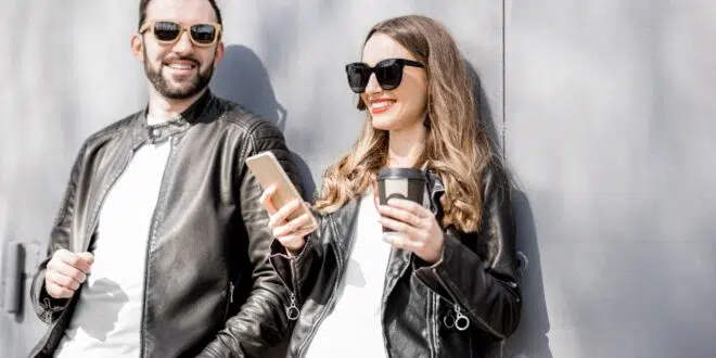 Stylish couple on the grey background