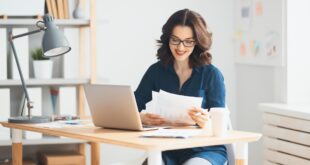 Woman working on a laptop.