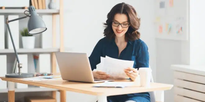 Woman working on a laptop.