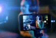 Young woman streaming a live video